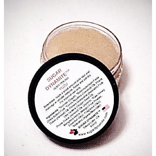 Travel size open jar of Yuzu scented hydrating body scrub